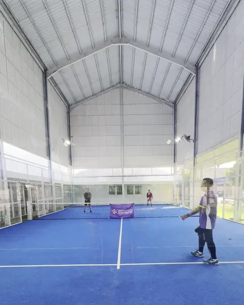 Padel player under the high roof