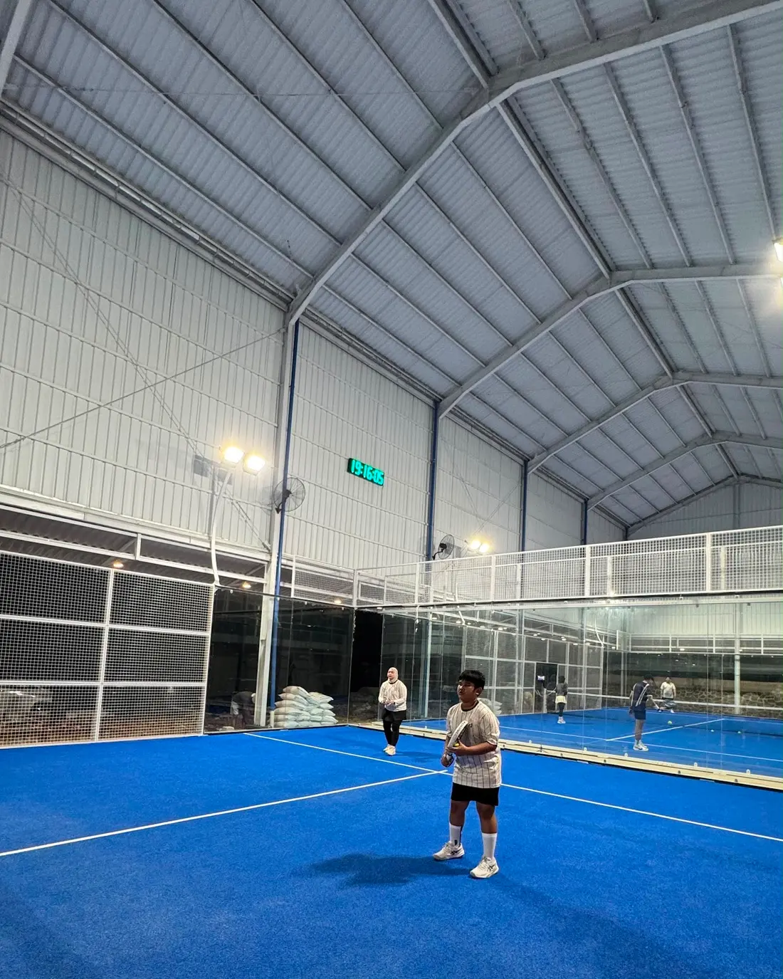 Covered blue padel court at Aviator Sports Hub